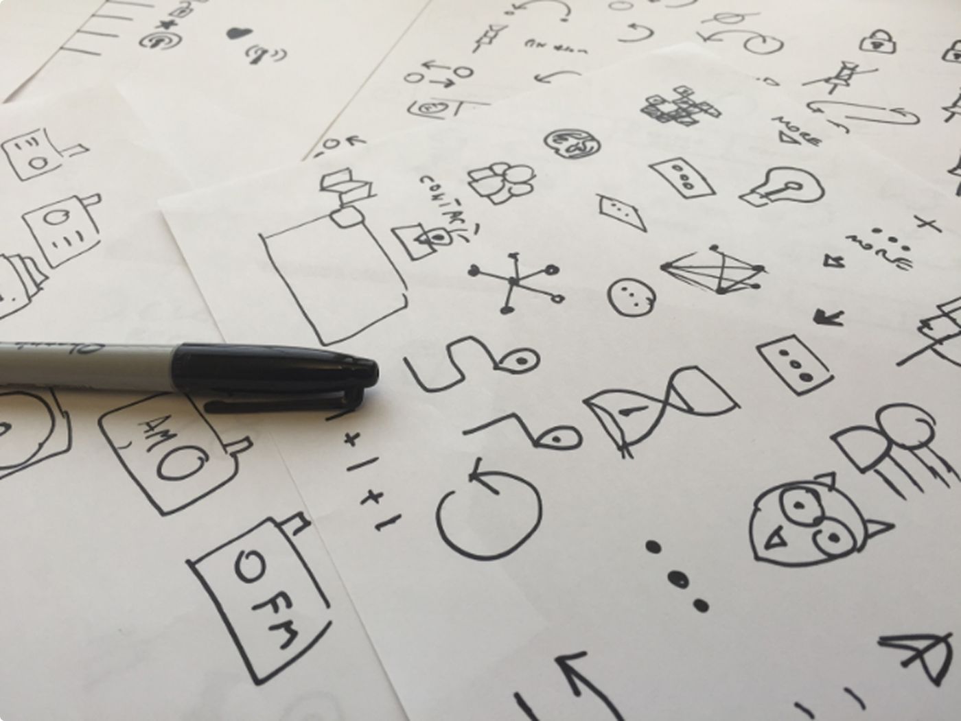 Whiteboard sketches of icon and interaction ideas