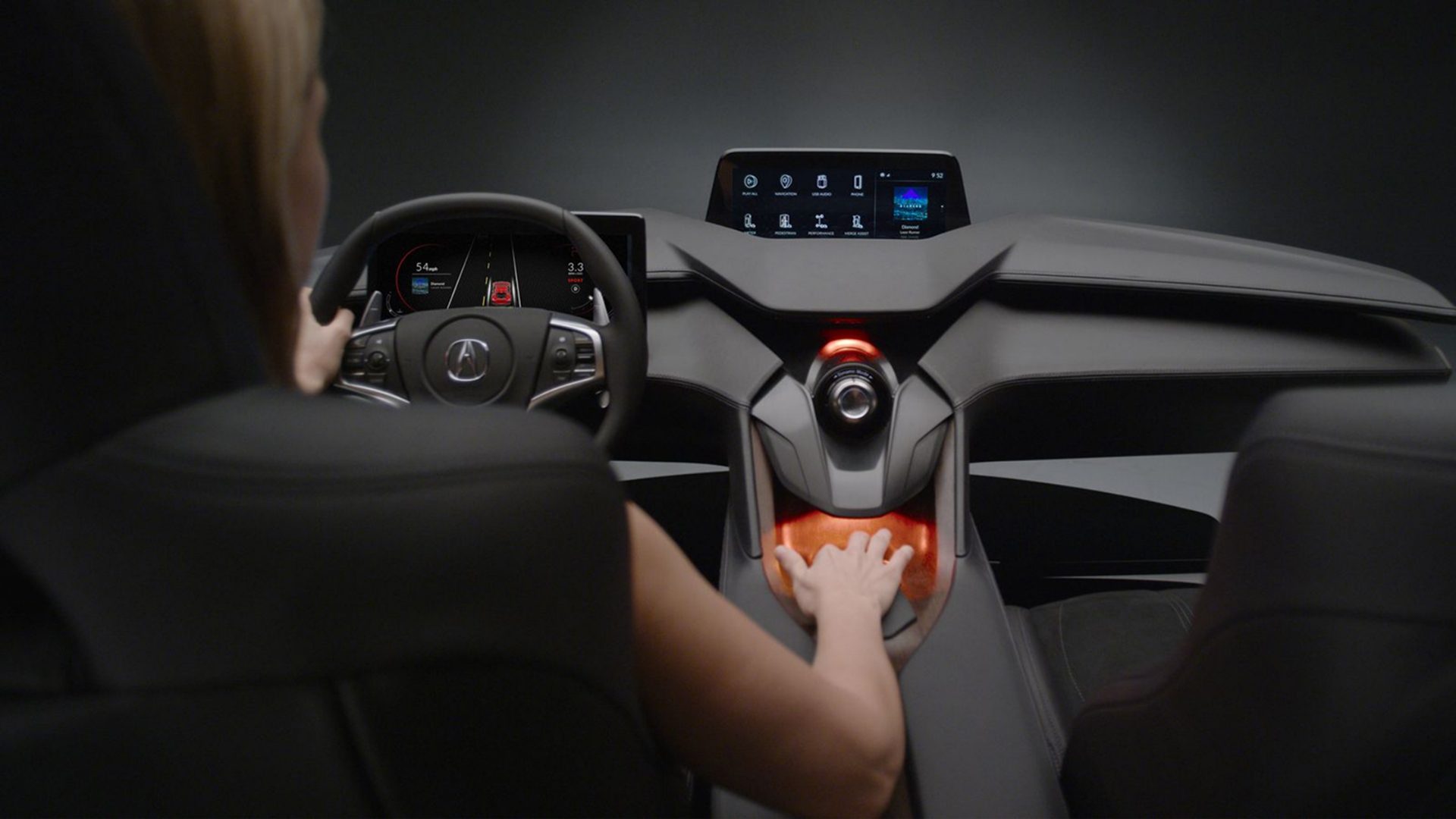 Concept car dashboard viewed from behind the driver, showing the display and touch controller